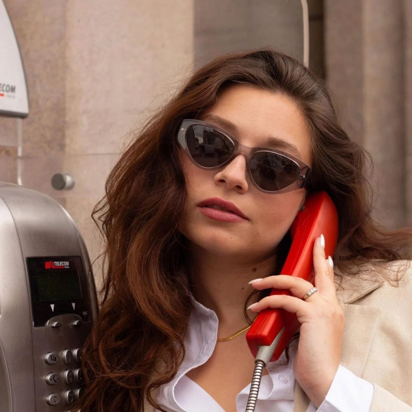 Photograph of a female model wearing the Scandola Transparent Gray sunglasses frame.