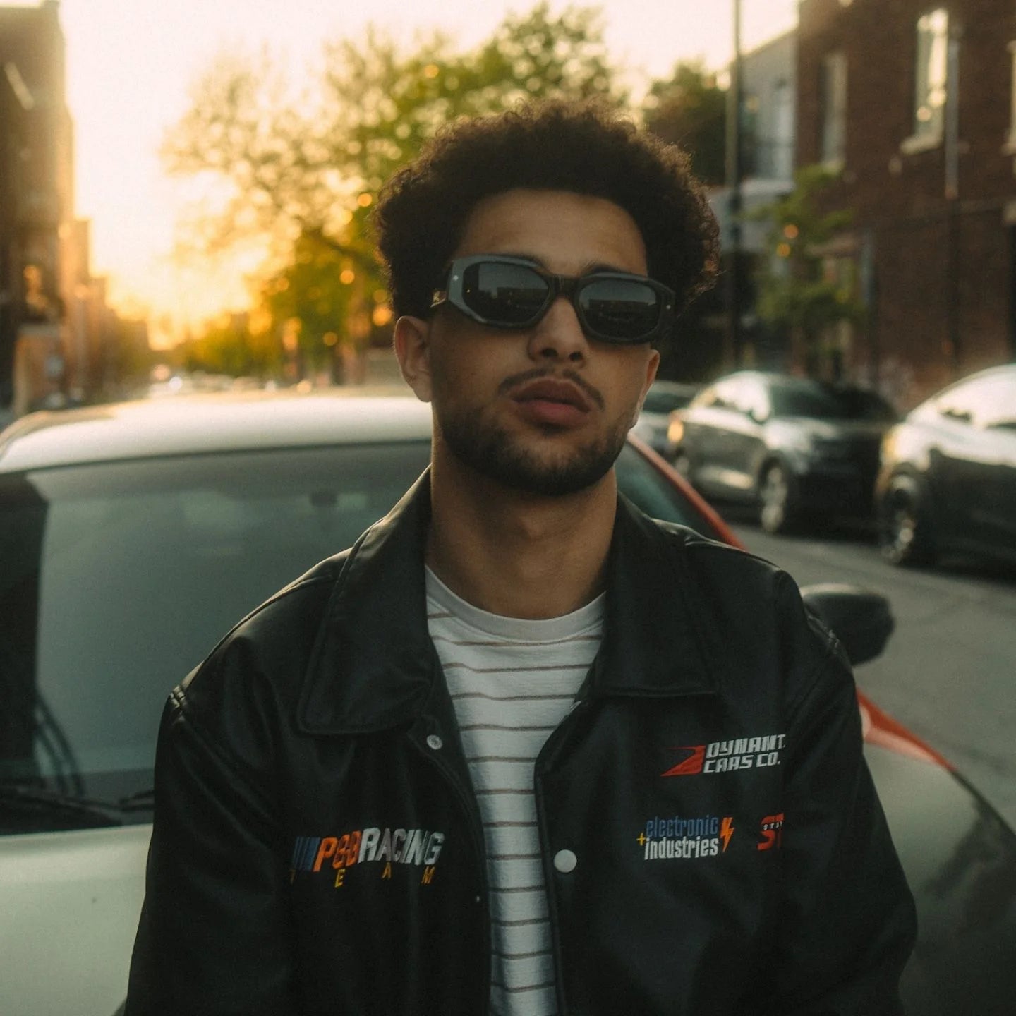 Photograph of a male model wearing the Tayrona Smoky Black sunglasses frame.