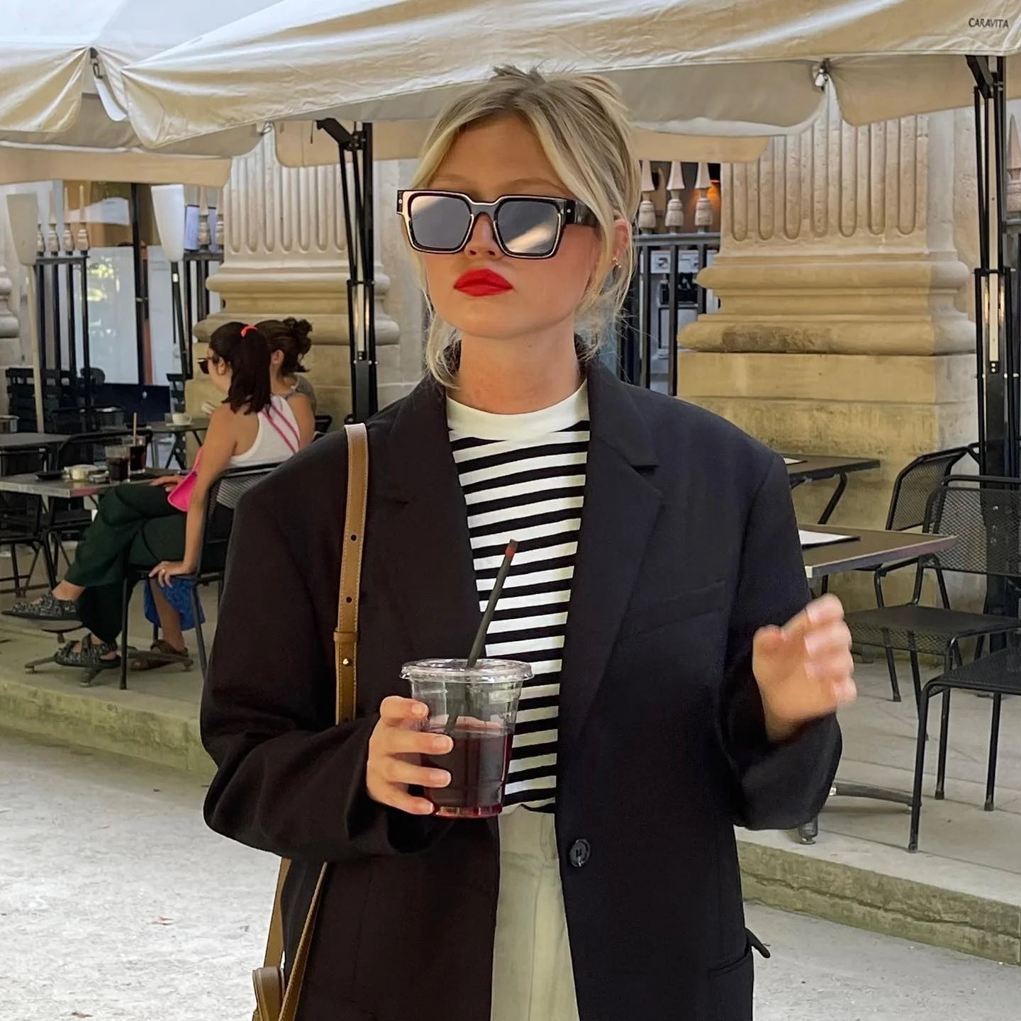 Photograph of a female model wearing the Yellowstone Smoky Black sunglasses frame.